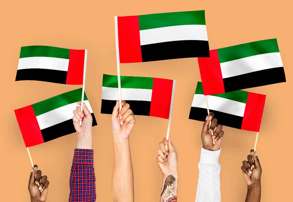 cover banner Free photo hands waving flags of the united arab emirates