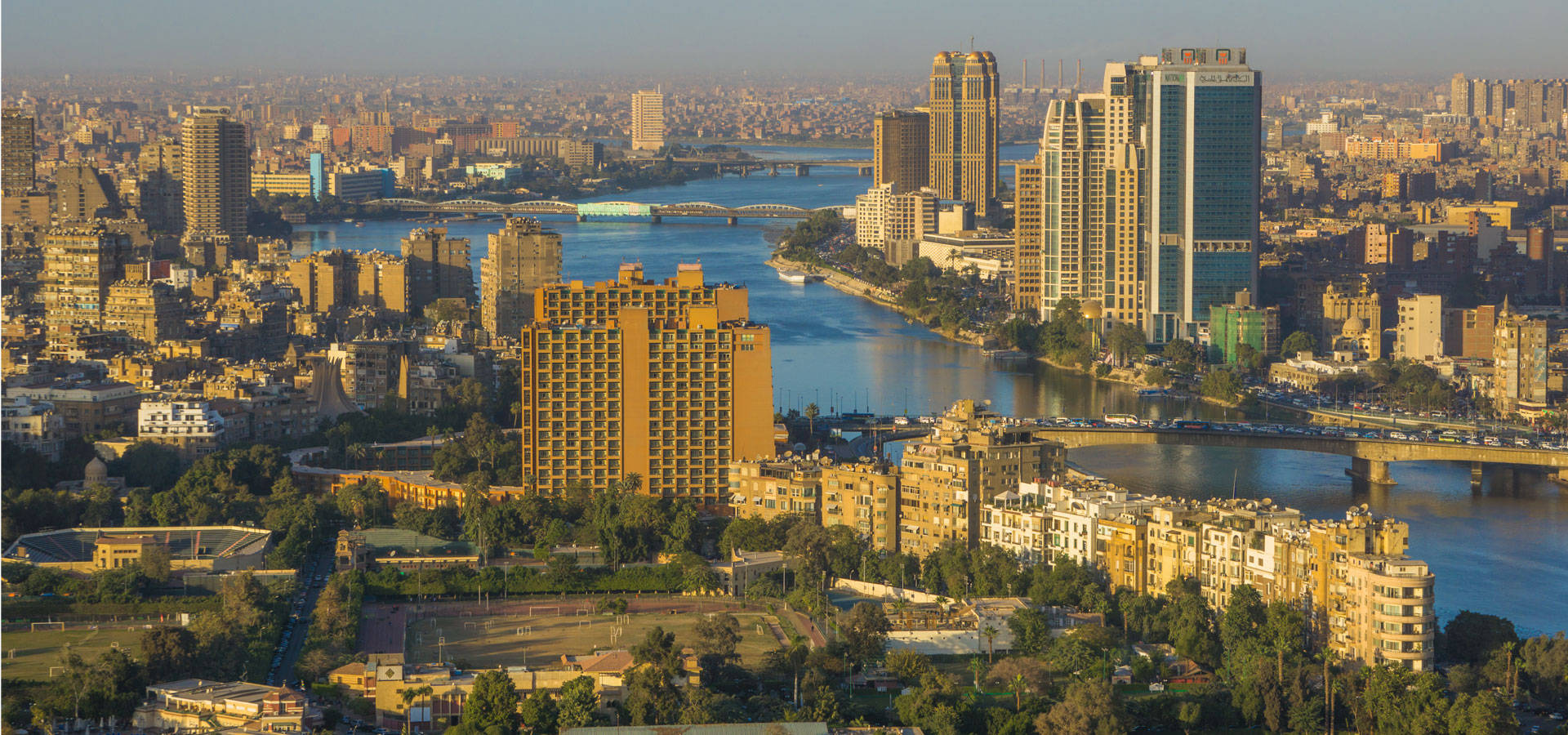 Image used for illustrative purpose. Cairo Skyline along Nile River. The bridge, the Nile river & the Corniche Street in central Cairo.